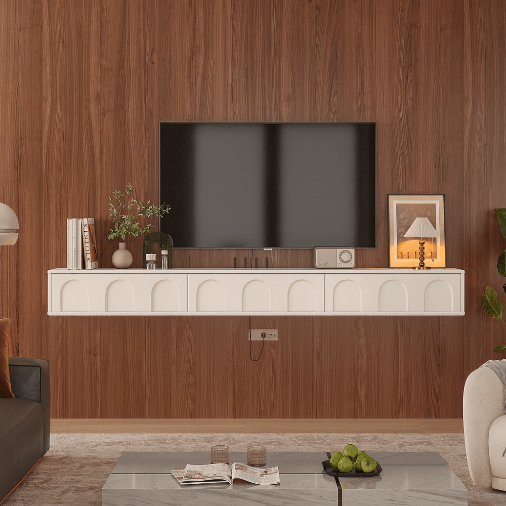White floating TV cabinet with decorative accessories on top, illustrating a space-saving living room design.