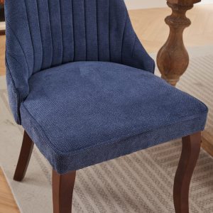 Stylish dining chair in blue fabric suitable for modern and transitional interiors