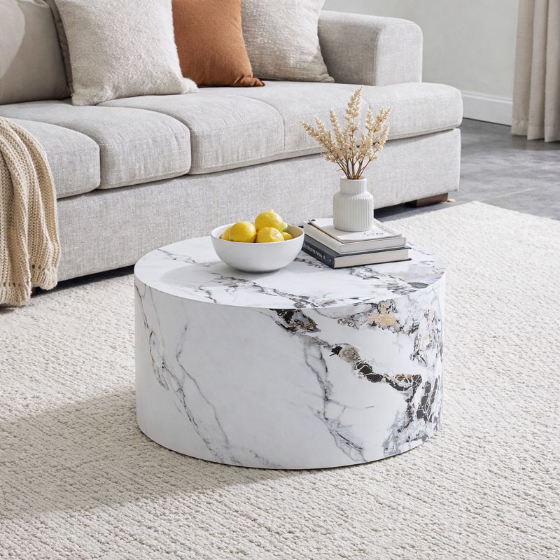 Round wooden coffee table with white marble veneer in modern minimalist living room