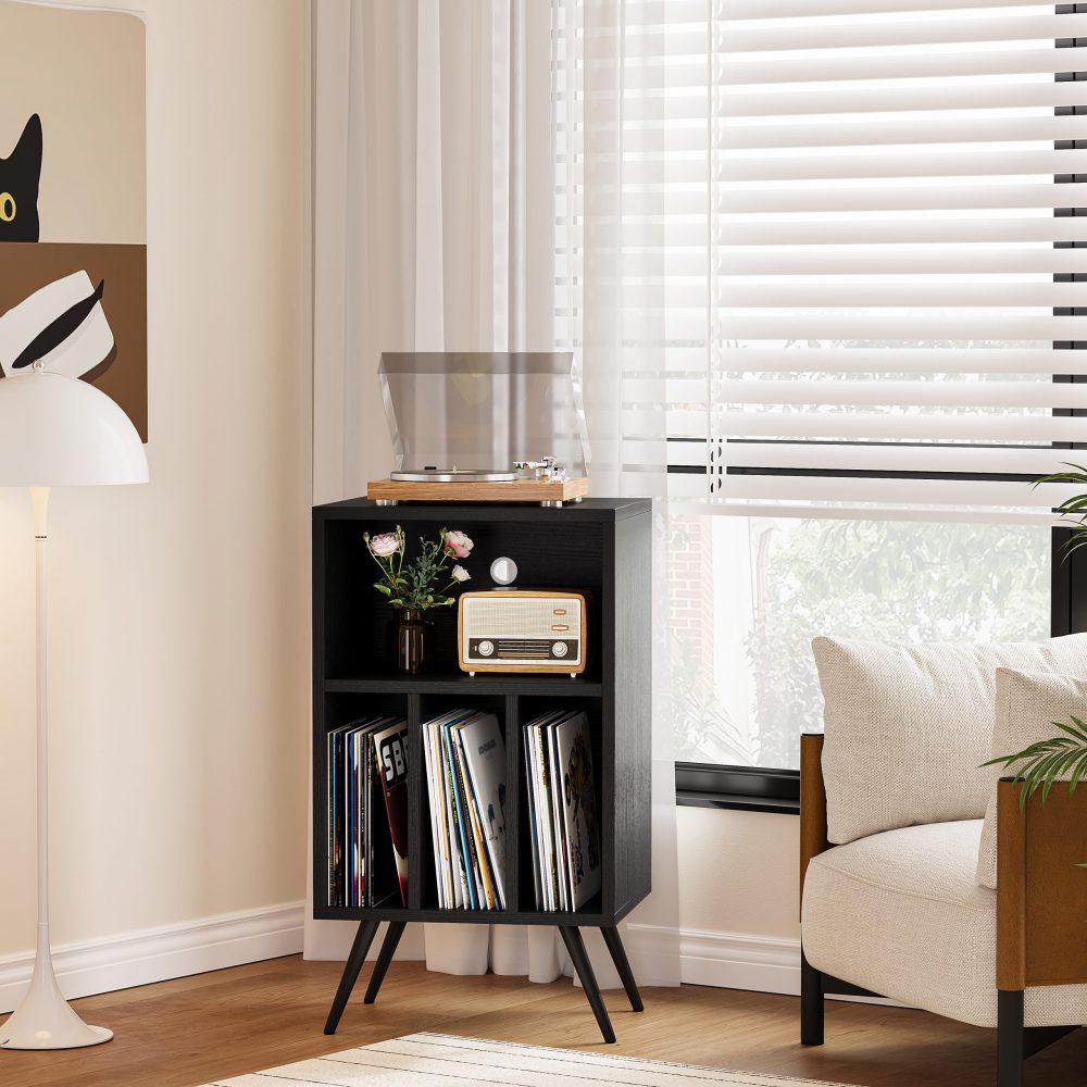 This is a black vinyl record stand modern display unit on the ground.