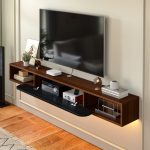 sleek under tv floating shelf with storage and decor