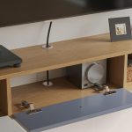 Solid wood floating TV stand with matte finish doors, ideal for clean and organized living spaces