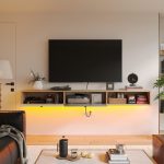 Two-door wall-mounted TV console with drop-down doors and sleek natural wood finish