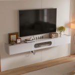 Minimalist wall-mounted white wood TV unit featuring central flip-down door with glass