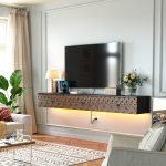 Slim floating media console in black and walnut for stylish living rooms