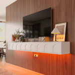Close-up of the smooth rounded corner of the white wall-mounted TV stand, highlighting its matte finish.