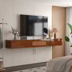 Walnut floating entertainment center under a wall-mounted television, with remote and controller visible on the shelves