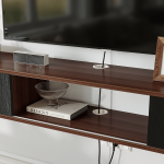 interior storage compartments behind the black sliding doors of the TV stand.