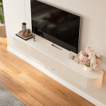 Minimalist white wall-mounted TV stand with cable management pre-hole