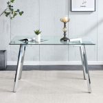 Clear glass dining table with silver carbon steel legs and clean lines