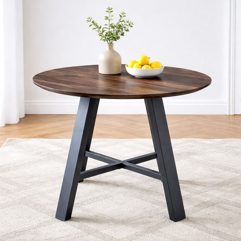 Minimalist round dining table with black metal support legs