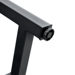 Modern black dining table paired with neutral décor and soft lighting