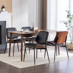 Modern dining chair set featuring black padded seat, vertical stitching, and wood accents