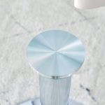 Modern glass dining table styled with vase and fruit plate