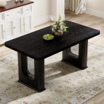 Rectangular black dining table with wood grain finish and glass centerpiece