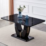 Rectangular dining table featuring black marble look surface and sculptural base