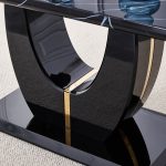 Rectangular dining table with glossy black surface and modern pedestal support