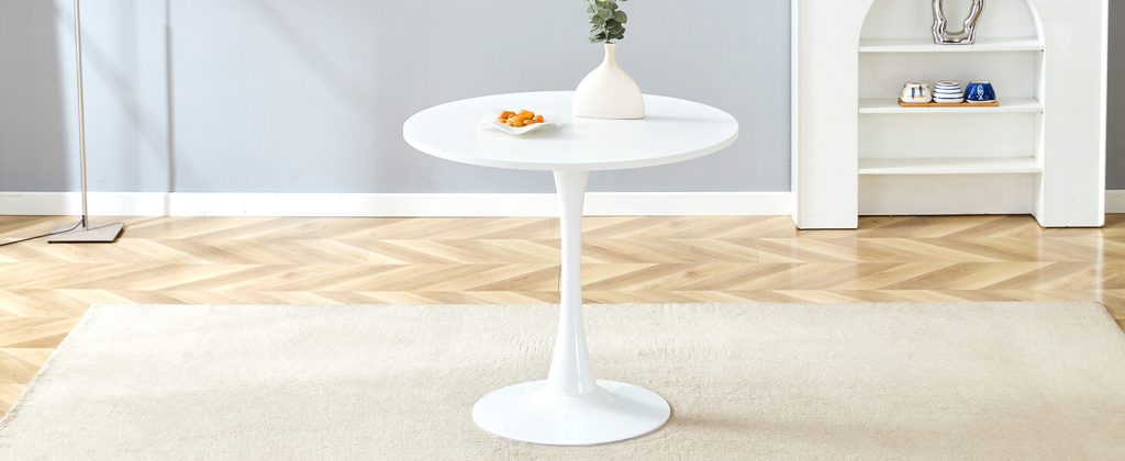 White round table styled for modern living room or dining nook