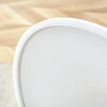 White tulip table featuring smooth round tabletop and sleek central pedestal