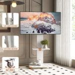 Detail view of a mobile TV stand, showing the upper media shelf and the base shelf with wheels.