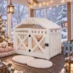 White wooden indoor pet house with pitched roof and cushion