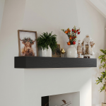 A close-up view of the floating fireplace mantel's edge, highlighting its clean construction