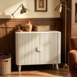 curved design and distinctive full-circle handle set, offering elegant internal storage solutions for a living or dining room.